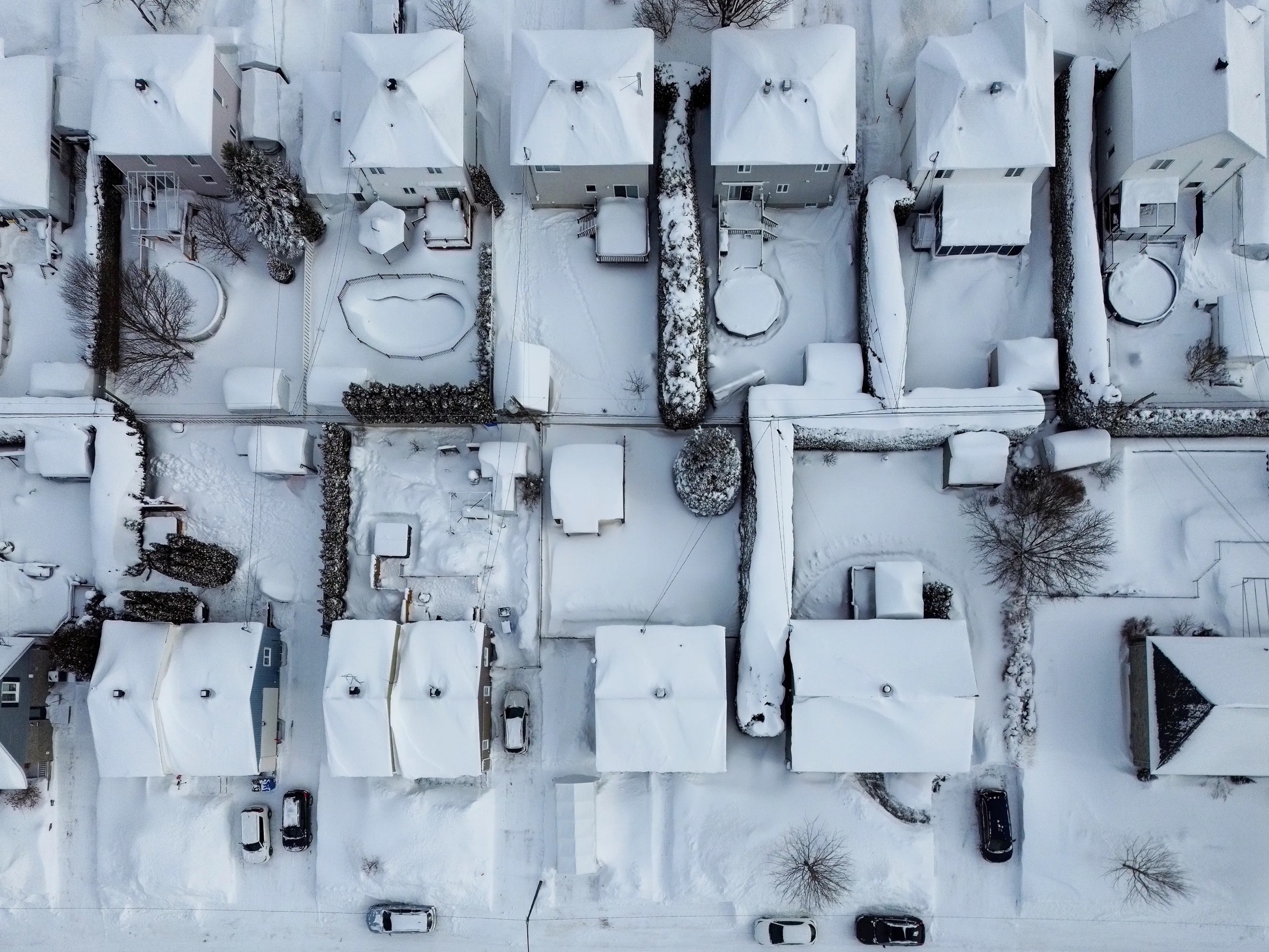 Aerial view of snow-covered houses and streets